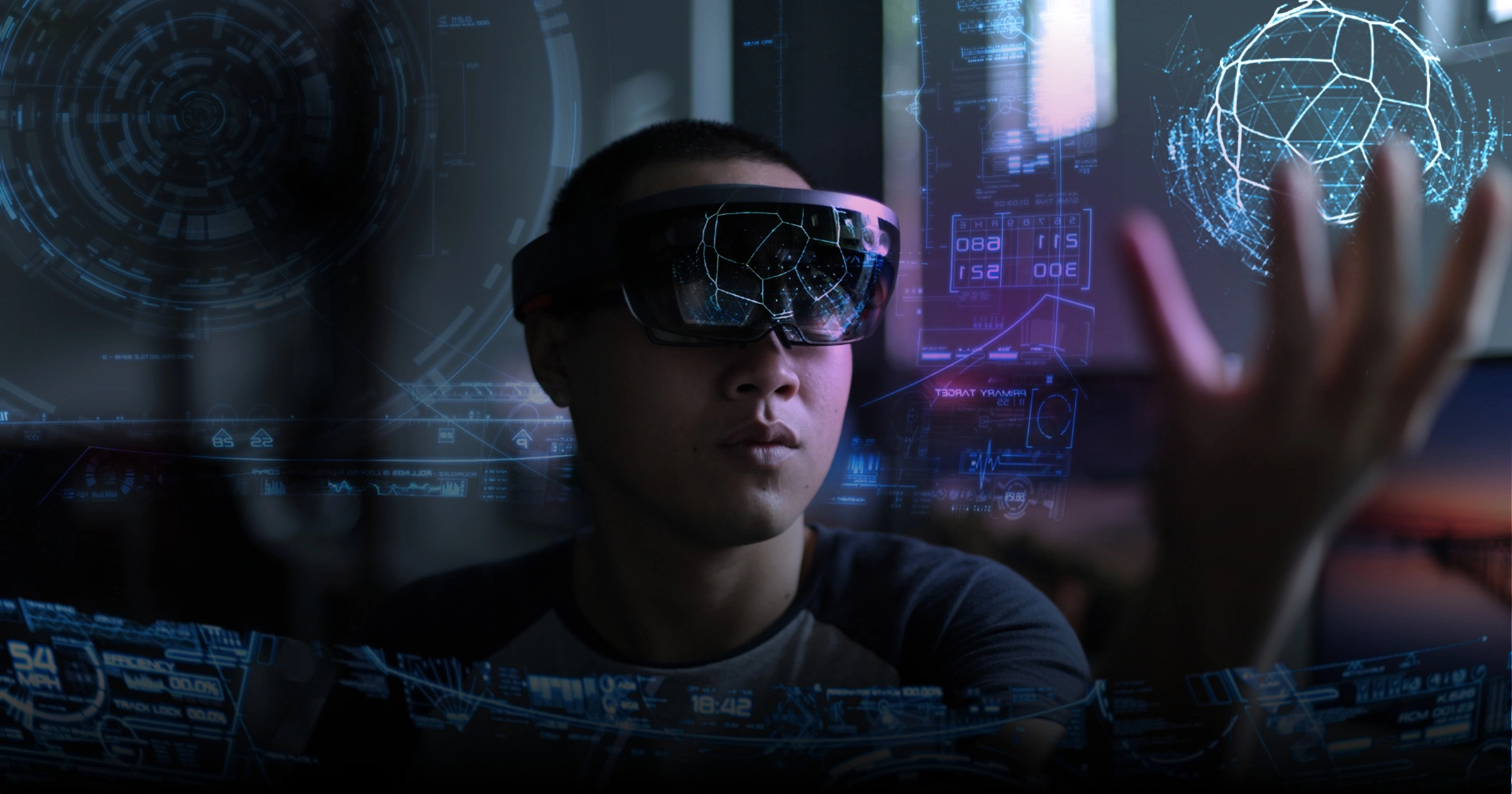 A Virtual Reality Training Company - Man wearing a hololens and manipulating a virtual image